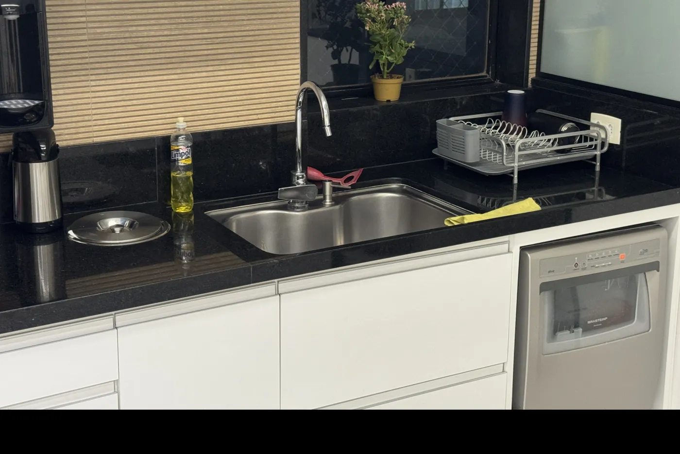 A kitchen with its original stainless sink